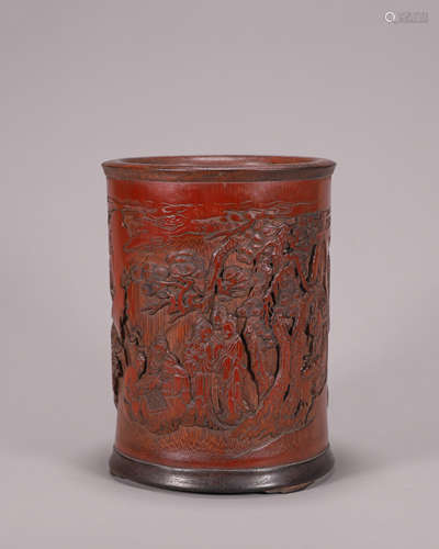 A figure carved bamboo brush pot