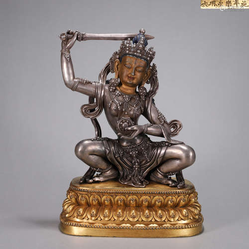 A silver Mahavairocana buddha statue