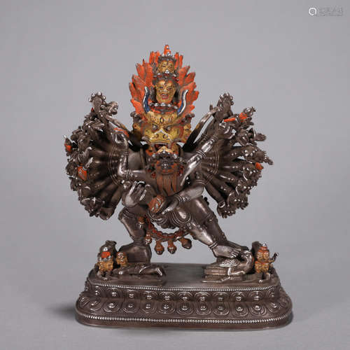 A silver Yamantaka statue