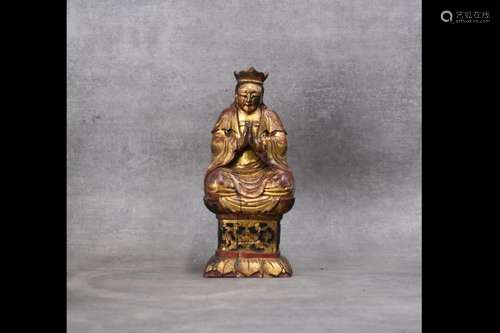 CHINE. Dignitaire en bois sculpté et laqué.