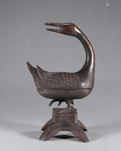 A copper duck shaped incense burner