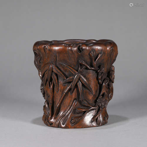 A plum blossom carved bamboo brush pot