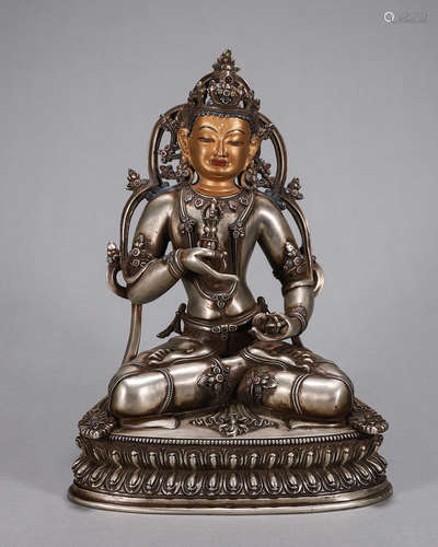 A silver Vajrasattva statue