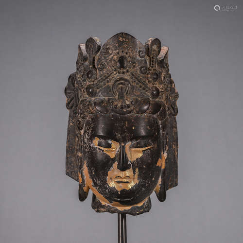 A gilt stone buddha head