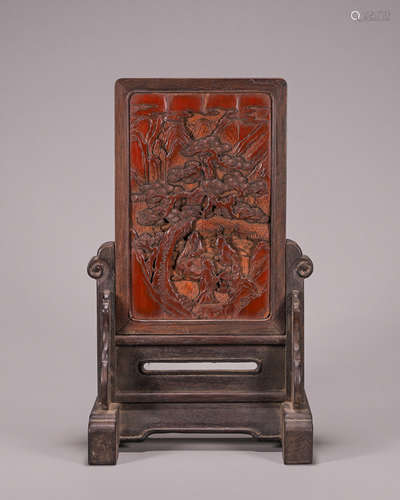 A figure carved bamboo screen