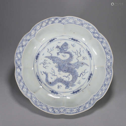 A blue and white cloud and dragon porcelain flower shaped pl...