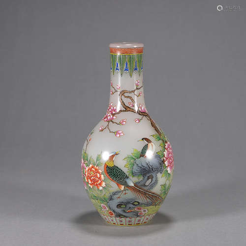 A bird and flower patterned glass vase