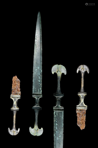 PAIR OF WESTERN ASIATIC BRONZE AND IRON DAGGERS