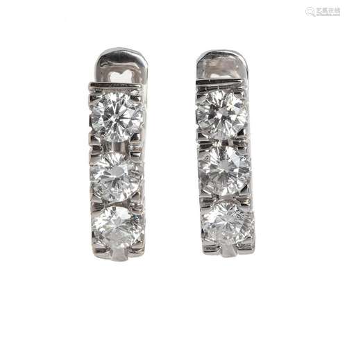 Creole earrings made in white gold centered by brilliant cut...