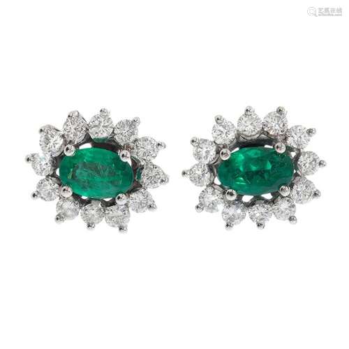 Pair of 18kt gold rosette earrings, emeralds of 0.70 cts. an...