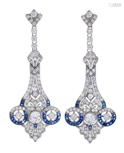 Pair of long earrings with movement. Three-part model with d...