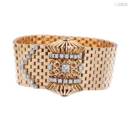 Belt bracelet in 18 kts. yellow gold. Model with woven mesh,...