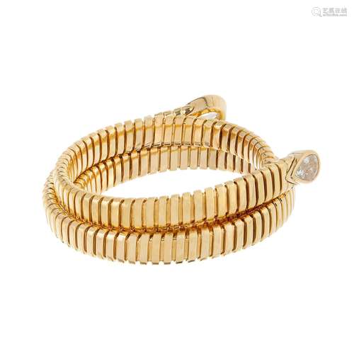 Flexible bracelet made of 18 kt yellow gold. Slave type brac...