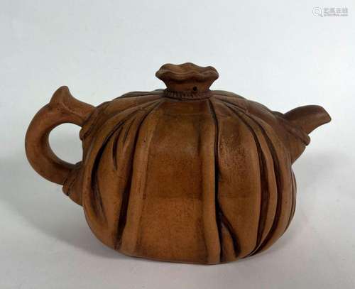 A Chinese Yixing Brown Clay Teapot with Gathered Detail