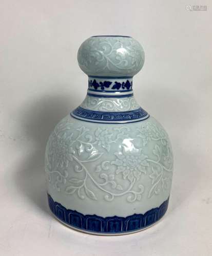 A Decorative Chinese Blue & White Vase with Emboss Flora...