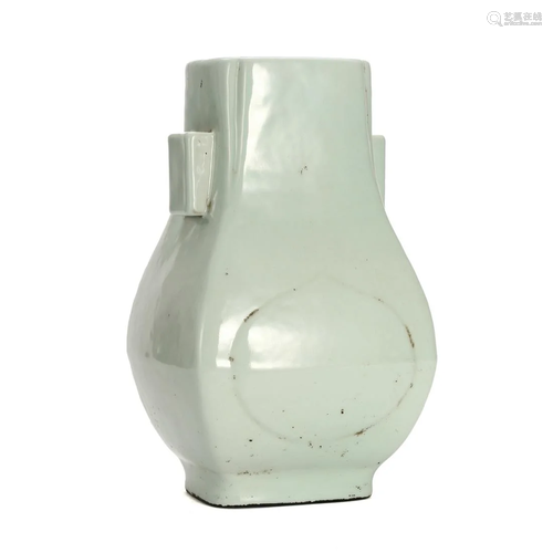 A CELADON GLAZED VASE WITH HANDLES