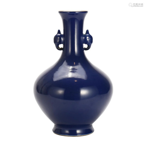 A BLUE-GLAZED VASE WITH HANDLES