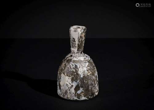 A SASANIAN CUT GLASS BOTTLE CIRCA 4TH-6TH CENTURY A.D