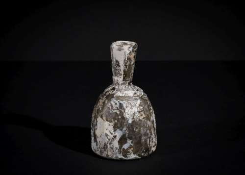 A SASANIAN CUT GLASS BOTTLE CIRCA 4TH-6TH CENTURY A.D