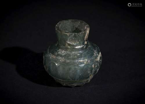 A POST SASANIAN CUT GLASS BOTTLE, 6TH-8TH CENTURY A.D