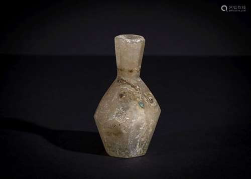 A THICK LOZENGE SHAPE SASANIAN CUT GLASS BOTTLE CIRCA , 4TH-...