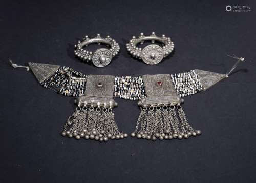 A SET OF A TRIBAL SILVER FILIGREE NECKALCE WITH TWO BRACELET...