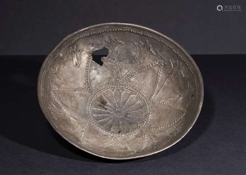 A SILVER REPOUSSE BOWL WITH LOTUS FLOWERS, IMITATING EARLY A...