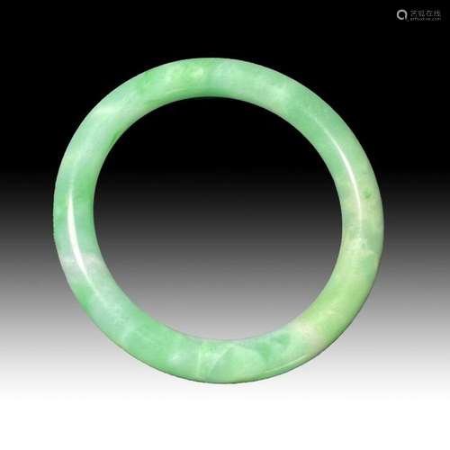 A LARGE CHINESE JADE BANGLE