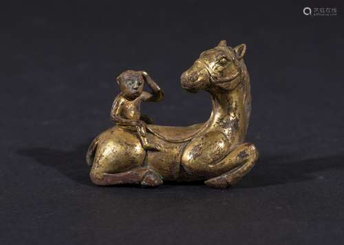 A CHINESE GILT BRONZE SEATED HORSE WITH MONKEY IN THE STYLE ...