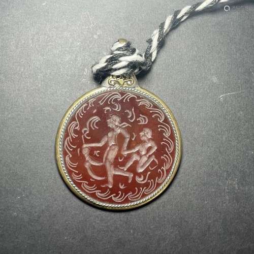 A STAMP SEAL OF A CUPID ON AGATE, SET AS A PENDANT 20TH CENT...