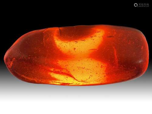 A LARGE CHERRY AMBER FRAGMENT