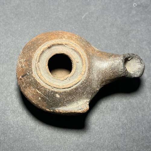 A ROMAN TERRACOTTA OIL LAMP LATE ROMAN PERIOD, 3RD-4TH CENTU...