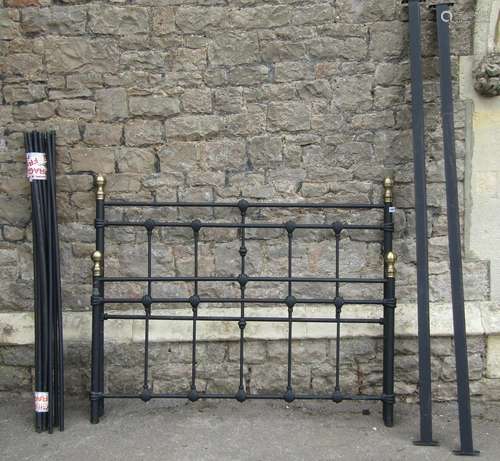 A Victorian style 4ft 6 double bedstead with light tubular f...