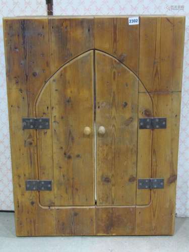 Stripped and waxed pine framed mirror enclosed by two hinged...