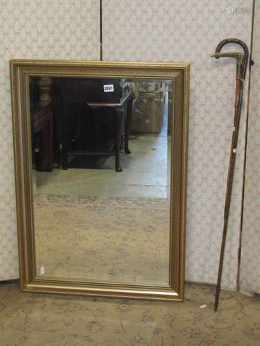 A rectangular gilt framed mirror with bevelled edge plate, 8...