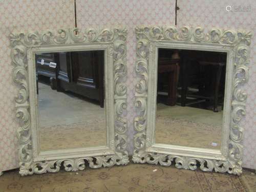 A pair of rectangular wall mirrors with acanthus scroll fram...