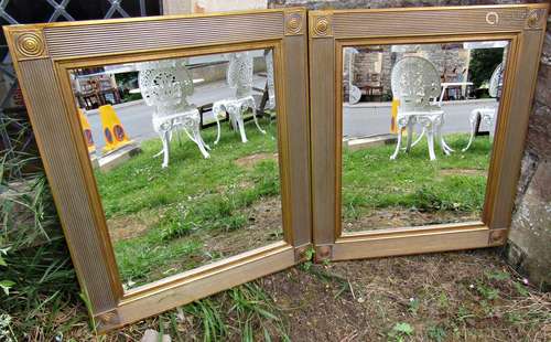 A pair of gilt framed mirrors with reeded borders and roundl...