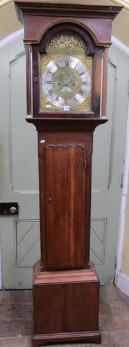 A Georgian oak longcase clock with brass dial and silver cha...