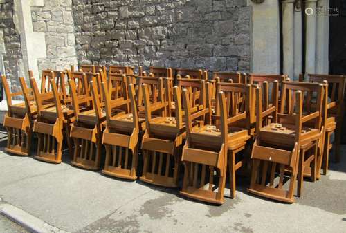 Set of twelve oak chapel chairs with stick backs, prayer boo...