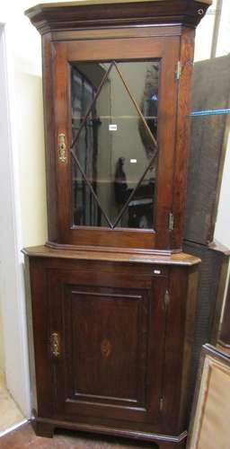 Two Georgian oak corner cupboards, one with panelled door an...