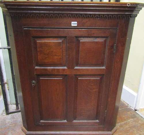 Georgian oak and elm lined hanging corner cupboard, the quar...