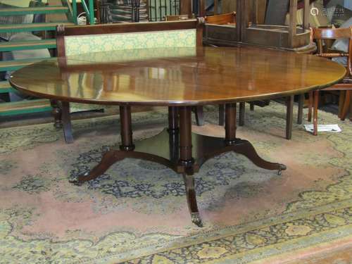 Georgian style dining table of circular form, raised on four...