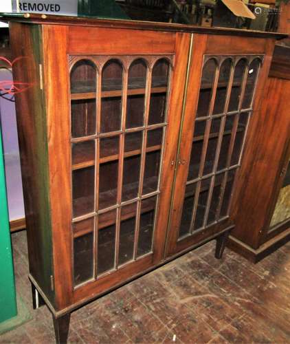 An early 19th century mahogany side cabinet enclosed by two ...