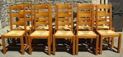 A set of ten oak ladderback dining chairs with pegged frames...