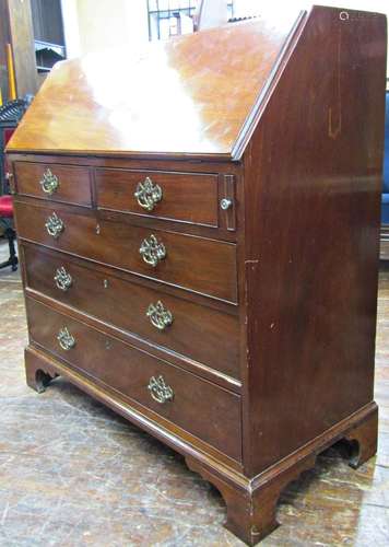 A Georgian mahogany bureau of three long and two short drawe...