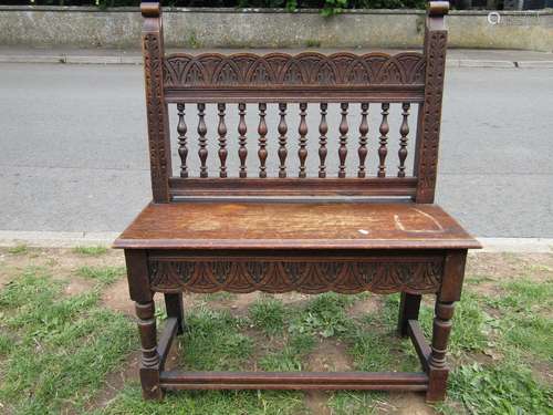 Small Victorian oak hall bench, the raised spindle back with...