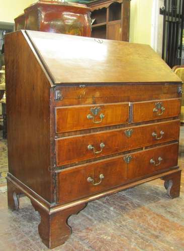 Antique walnut bureau, the fall flap enclosing a fitted inte...