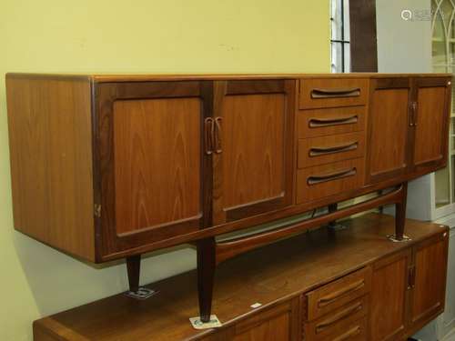 G plan teakwood sideboard, the central tower of four drawers...