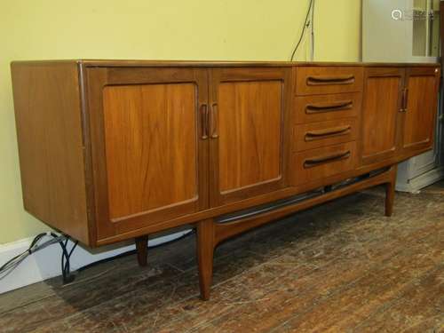 G plan teakwood sideboard, the central tower of four drawers...