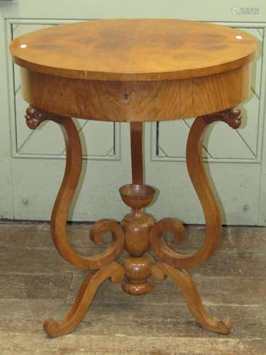 A 19th century Biedermeier ladies sewing table of circular f...